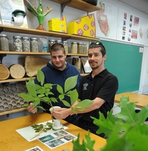 Plant Science and Landscape Technology Professor Jim Funai (left) working with a student on plant identification